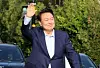 Former President Yoon Suk Yeol waves to supporters as he leaves the presidential residence in Hannam-dong, Yongsan District, in central Seoul on April 11. [NEWS1]