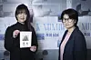 Mioka Miller, left, holding a picture of herself as a missing baby, and director Jo Se-young, pose during an interview with the JoongAng Ilbo on May 15. [JOONGANG ILBO]