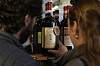 Carlos Olivares, left, and Morgan Berry look at a bottle of Padelletti Rosso di Montalcino Riserva, from Italy, at DECANTsf Bottle Shop and Bar in San Francisco, on March 13. [AP/YONHAP]