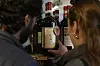 Carlos Olivares, left, and Morgan Berry look at a bottle of Padelletti Rosso di Montalcino Riserva, from Italy, at DECANTsf Bottle Shop and Bar in San Francisco, on March 13. [AP/YONHAP]
