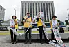 Choi Seong-ryong, head of the Families of Abductees to North Korea Association, second from left, speaks at a press conference in front of the Seoul Government Complex Seoul in Jongno District, central Seoul, on June 16, explaining the purpose and contents of the group's leaflet campaign to North Korea and urging the government to confirm the fate of their abducted family members. [YONHAP]