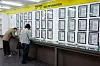 People fill out forms in front of a job information board at the Seoul Western Employment and Welfare Plus Center in Mapo District, western Seoul on Nov. 12. [NEWS1]