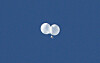 Balloons carrying trash float above the Jonno District of Seoul after being launched by North Korea. [NEWS1]