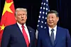 U.S. President Donald Trump, left, and Chinese President Xi Jinping pose together ahead of their summit at Gimhae International Airport in Busan on Oct. 30. [AP/YONHAP]