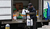 A man moves ingredients before opening for business at a restaurant district in Seoul, in this file photo taken on Jan. 26. [YONHAP]