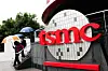 People walk beside TSMC signage outside the company's Museum of Innovation at its headquarters in Hsinchu, northern Taiwan, on Nov. 21, 2024. [AFP/YONHAP]