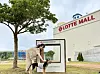A person pets her dog in front of the Lotte Premium Outlets DongBusan in Busan. [JOONGANG ILBO]