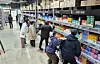 Customers consult with a pharmacist while purchasing medicine at a warehouse-style pharmacy in the Suwan New Town area of Gwangsan District, Gwangju, on Jan. 18. [HWANG HEE-GYU]