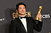 Actor Steven Yeun poses with the award for Best Performance by an Actor in a Limited Series, Anthology Series or a Motion Picture Made for Television for 'Beef' in the press room during the 81st annual Golden Globe Awards at the Beverly Hilton Hotel in Beverly Hills, California, on Monday. [AFP/YONHAP]