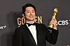 Actor Steven Yeun poses with the award for Best Performance by an Actor in a Limited Series, Anthology Series or a Motion Picture Made for Television for 'Beef' in the press room during the 81st annual Golden Globe Awards at the Beverly Hilton Hotel in Beverly Hills, California, on Monday. [AFP/YONHAP]