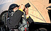 Master Sgt. Wi In-tae of the Korean Air Force’s 53rd special flying squadron takes photographs of the Black Eagles' aerial performance from the rear seat of one of the team's T-50B aircraft at the World Defense Show in Riyadh, Saudi Arabia, on Feb. 9. [REPUBLIC OF KOREA AIR FORCE]