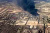 This handout picture provided by the media office of the Iranian presidency shows heavy smoke billowing at the site of an explosion that took place a day earlier at the Shahid Rajaee port dock southwest of Bandar Abbas in the Iranian province of Hormozgan on April 27. [AFP/YONHAP]