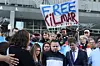 Jennifer Vasquez Sura, front left, her husband Kilmar Abrego Garcia, front center, and Attorney Simon Sandoval-Moshenberg, front right, attend a protest rally at the Immigration and Customs Enforcement field office in Baltimore on Aug. 25, to support Kilmar Abrego Garcia. [AP/YONHAP]