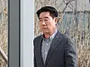 Choi Yoon-gil, former chairman of the Seongnam City Council, leaves Suwon District Court in Suwon, Gyeonggi, after his first trial on Feb. 14. 2024. [YONHAP]