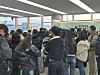 Passengers at Gimhae Airport wait to register their passports and biometric information at a registration desk on Jan. 17. Passengers who preregister their passports, faces and palms can be screened more quickly at a counter that is open just for registered users. [KIM MIN-JU]