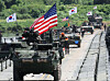 U.S. Stryker armored vehicles and Korean K200 armored vehicles cross a pontoon bridge during a combined U.S.-Korea arms maneuver crossing exercise in Yeoju, Gyeonggi, on Aug. 27. [YONHAP]