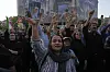 Protesters chant slogans as one of them holds up a poster of the Iranian Supreme Leader Ayatollah Ali Khamenei in a protest following the U.S. attacks on nuclear sites in Iran, in Tehran, Iran, Sunday, June 22, 2025. [AP/YONHAP]