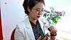 A North Korean holds a foldable smartphone on state-run TV. [SCREEN CAPTURE]