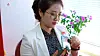 A North Korean holds a foldable smartphone on state-run TV. [SCREEN CAPTURE]