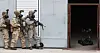 U.S. soldiers send in a military robot into a room at a training ground simulating a North Korean weapons of mass destruction facility in Paju, Gyeonggi, during joint drills with U.S. troops on March 12. [JOINT PRESS CORPS]