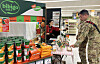 Soldiers try CJ CheilJedang's products at the food and beverage firm's launch event for its 14 items including tteokbokki (spicy rice cakes) and plant-based dumplings at a U.S. commissary in Guam. [CJ CHEILJEDANG]