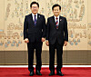 President Lee Jae Myung, left, and Unification Minister Chung Dong-young pose for a photo after a ceremony held at the presidential office in Seoul on July 28. [YONHAP]