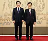 President Lee Jae Myung, left, and Unification Minister Chung Dong-young pose for a photo after a ceremony held at the presidential office in Seoul on July 28. [YONHAP]