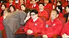People Power Party interim leader Han Dong-hoon listens solemnly to a report from a party official after seeing the exit poll results for the general election at a PPP situation room in the National Assembly in Yeouido, western Seoul, Wednesday. [NEWS1]