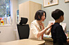 Kim Ji-hyun, a professor of pediatric allergy and respiratory diseases at Samsung Medical Center, examines a six-year-old patient with food allergies in early November. [SAMSUNG MEDICAL CENTER]