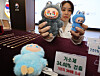 A Korea Customs Service official displays a counterfeit Labubu keyring that tested positive for toxic chemicals, alongside a genuine version of the toy, during a press briefing held in Gangnam District, southern Seoul, on Nov. 5. [YONHAP]
