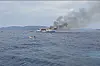In this photo made from video released by the Indonesian National Search and Rescue Agency (Basarnas), smoke billows from passenger ship KM Barcelona after it caught fire in the waters off Talise Island in North Sulawesi, Indonesia, Sunday, July 20. [AP/YONHAP