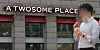 A passerby walks in front of a A Twosome Place store in Seoul on March 24. [YONHAP]