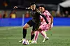 Los Angeles FC forward Son Heung-Min dribbles against Inter Miami defender Ian Fray during the first half of an MLS match in Los Angeles on Feb. 21. [AP/YONHAP]