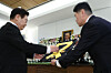 President Lee Jae Myung, left, posthumously confers the Mugunghwa Medal at the memorial altar for Lee Hae-chan, senior vice chair of the National Unification Advisory Council, at Seoul National University Hospital Funeral Hall in Jongno District, central Seoul, on Jan. 27. [JOINT PRESS CORPS]