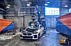 A giant excavator crushes a BMW sedan to extract wiring harnesses, which contain recyclable copper, at the company's Recycling and Dismantling Center on the outskirts of Munich. [BMW KOREA]
