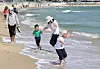 Children run across the Haeundae Beach in Busan on April 21. [YONHAP]