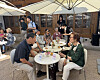 Older adults participating in Jongno District's matchmaking event converse during a table talk at Mugyewon in central Seoul on June 12. [CHO JUNG-WOO]