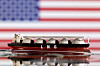 Model of LNG tanker is seen in front of the U.S. flag in this illustration taken on May 19, 2022. [REUTERS/YONHAP]