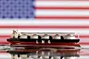 Model of LNG tanker is seen in front of the U.S. flag in this illustration taken on May 19, 2022. [REUTERS/YONHAP]