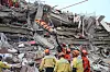 Members of the China Search and Rescue Team and the Rescue Team of Ramunion jointly transfer a pregnant survivor at a quake site in Mandalay city, Myanmar on March 31. [XINHUA/YONHAP]