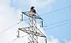 Staff from the Korea Electric Power Corporation (Kepco) repair a pylon in Nonsan, South Chungcheong, on Oct. 14, 2021. [JOONGANG ILBO]