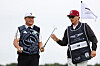 Im Sung-jae passes his putter to his caddie, William Wilcox, on the eighth green during day four of the Genesis Scottish Open at The Renaissance Club in North Berwick, Scotland on Sunday.  [GETTY IMAGES]