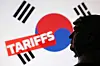 A 3-D printed miniature model of U.S. President Donald Trump is pictured with the Korean flag and the word ″Tariffs″ in this illustration taken on July 23. [REUTERS/YONHAP]