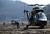 Korean and U.S. troops conduct a tactical maneuver after disembarking from a Surion helicopter during a joint air assault drill in Paju, Gyeonggi, on March 11. [JOINT PRESS CORPS]