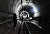 Passengers evacuate through an underground tunnel after a fire broke out on a Seoul Metro Line No. 5 train on May 31. [YONHAP]