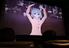 Virtual artist Moon Bo-na from the film “Virtual Symphony: The First Note” poses for the audience during an interactive cinema showcase in Yongsan District, central Seoul, on Dec. 9. [YONHAP]