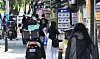 Delivery riders are seen in front of a restaurant in downtown Seoul on May 25. [YONHAP]