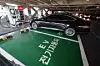 Starting this year, the government will provide up to 1 million won ($700) more in subsidies than before to buyers who scrap or sell an internal combustion engine vehicle and purchase an electric vehicle. The photo shows an EV charging station at a supermarket in Seoul on Jan. 2. [YONHAP]