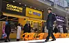 Discount cafes selling low-price coffees are seen on a street in Jongno District, central Seoul, on Feb. 21. [YONHAP]