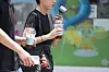Citizens walk by a downtown area in Daegu with iced coffee and portable electric fans as heat advisories were issued in the region on June 28. [YONHAP]